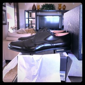 Prada black patent leather dress shoes.
